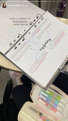 an open notebook sitting on top of a table