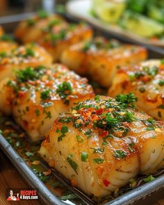 some food that is sitting on a metal tray and ready to be cooked in the oven