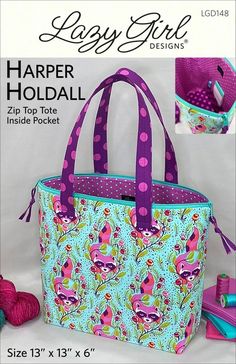 the large bag is designed to look like it's made from fabric and has purple handles