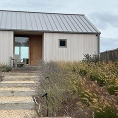 a small house with steps leading up to it