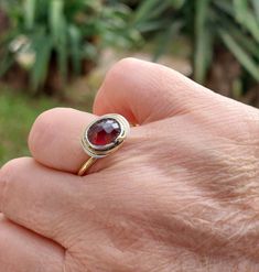 Introducing this exquisite handmade Carnelian Solitaire Ring, meticulously crafted with a harmonious blend of brass and silver. This captivating piece showcases the natural beauty of Carnelian, a gemstone renowned for its fiery, reddish-brown hues and enchanting energy. The centerpiece of this ring is a genuine Carnelian gemstone, carefully hand-selected for its captivating color and unique patterns. Its warm, earthy tones evoke a sense of passion and vitality, making it a perfect choice for those seeking a bold and expressive accessory. The Carnelian gemstone is delicately set in a classic solitaire design, allowing the stone to take center stage and be admired from every angle. The sleek band is expertly handcrafted from a combination of brass and silver, blending the rustic charm of bra Red Engagement Ring, Carnelian Ring, Reddish Brown, Brass Ring, Organza Gift Bags, Anniversary Ring, Ring Wedding, Ring Handmade, Earthy Tones