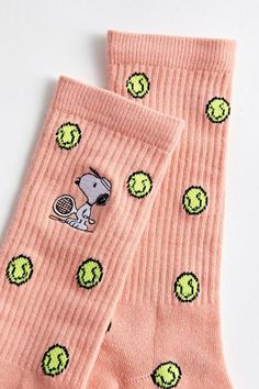 Tennis ball pattern crew socks with a Snoopy motif embroidered at the side. Cushioned socks with a ribbed knit ankle cuff. Features Crew length socks Ribbed knit ankle cuff Embroidered Snoopy motif Content + Care Includes 1 pair 95% Cotton, 3% polyester, 2% spandex Machine wash Imported | Snoopy Tennis Crew Sock in Peach, Men's at Urban Outfitters Cute Pattern Socks, Cute Fun Socks, Fun Socks Aesthetic, Cute Crew Socks, Fun Socks Outfit, Cool Socks Aesthetic, Cute Socks Aesthetic, Cute Thigh High Socks, Snoopy Tennis