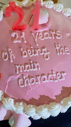 a pink birthday cake with white frosting and the number twenty two years old being the main character