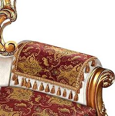 an ornately decorated chair with gold trimmings and red velvet upholstered