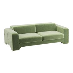 a green couch sitting on top of a white floor