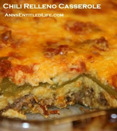 a cheesy casserole with meat and peppers on it is shown in a pan