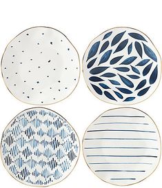 three plates with blue and white designs on them