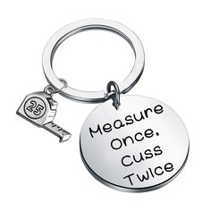 a keychain with the words measure, once, cuss twice on it