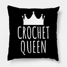 a black and white pillow with the words crochet queen printed in white on it