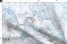 a white and blue marble textured background with measurements for the fabric to be cut in half