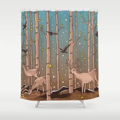 a shower curtain with deer in the woods