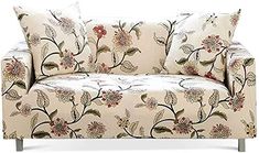 a floral couch with two pillows on it