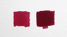 two red inks on white paper with the same color as it appears to be