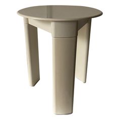 a white table with an oval shaped top and two legs on the bottom, against a white background