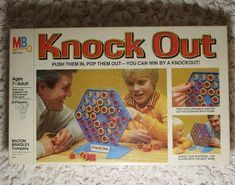 an advertisement for the game knock out with two children playing and one adult looking at it