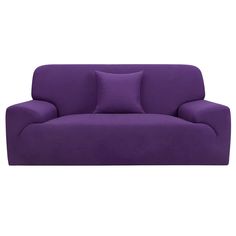 a purple couch with two pillows on it's back and one pillow in the middle