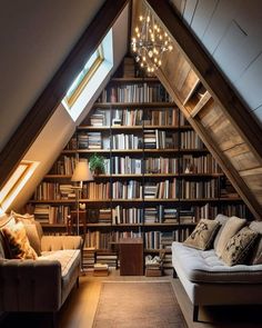 an attic living room with bookshelves and couches