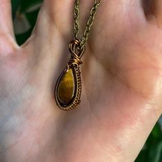 This item is made to order, please allow 2-14 days for order fulfillment. This mini pendant is made with a tigers eye crystal and brown copper filled wire. Measurements: 1 in x .5 in Comes with a 16 in chain. Please keep in mind that this item is handmade, so every pendant will not look exactly the same. Tigers eye is known to release fear and anixety and help harmony and balance. Crystal Necklace Copper, Tigers Eye Pendant, Copper Aesthetic, Tigers Eye Jewelry, Sign Aesthetic, Tigers Eye Crystal, Release Fear, Brown Copper, Tiger Eye Gemstone