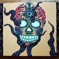 a painting with an octopus and skull on it