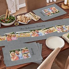 the table is covered with photos and place mats for guests to sit down at it