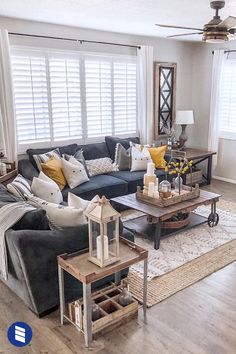 a living room filled with furniture and windows