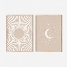 two framed art prints with the moon and stars on them, one in beige and one in white