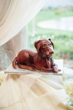 a dog figurine sitting on top of a table