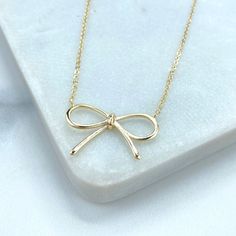 18k Gold Filled Ribbon Bow Necklace, 16 Inches with Extender, 1mm Curb Link Chain and Cute Bow Charm Necklace, Wholesale Jewelry. - Necklace Size: Length: 16 Inches +2 Inches |  Thickness: 1mm - Pendant Size: Length: 15mm  | Width: 24mm |  Thickness: 1mm 💎 Discover DiJu Jewelry: Your Destination for Quality and Style With new products added daily, DiJu Jewelry offers a wide selection of unique, modern designs at competitive prices. We prioritize elegance and keep pace with the latest market trends. - Elevate Your Jewelry Business - Start Your Own Venture - Create Your Own Collection 📲 Explore a myriad of styles in our DiJu Jewelry Etsy Store: DiJu Jewelry Etsy Store 💎 Our collection features a diverse range of distinctive styles, including earrings, necklaces, pendants, charms, bracelet Necklace Coquette, Bow Necklace, Cute Bow, Necklace Size, Ribbon Bow, Jewelry Business, Chain Choker, Cute Bows, Gold Filled Jewelry