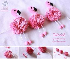 three pink pom - poms are hanging from the side of a white sheet