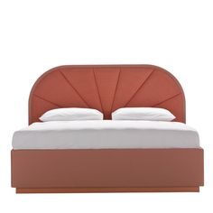 a bed with an orange headboard and white sheets