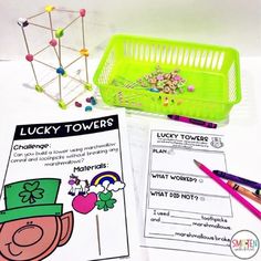 the lucky towers activity is shown with markers and pencils on paper next to it