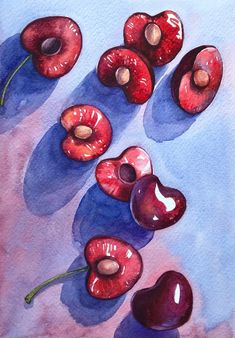 watercolor painting of cherries and whole cherries on blue paper with shadow from them