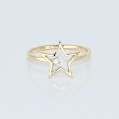 14k Solid Gold Dainty Star Ring, Real Gold Open Star Ring with premium grade D Color (colorless) VS/SI clarity moissanite.  💙 Our jewelry is handcrafted with love and great care at San Francisco Bay! All of our items are 14k stamped for authenticity. 💙 You will receive them exactly as pictured. We don't use any filters, all photos are authentic and unedited.   💙 Dimensions: Band thickness: 1.5 mm, Star: 12 mm. 💙 The ring material is 14k Solid gold, should not be confused with gold plating or filling. It won't tarnish or fade over time. 💙 We're offering the finest quality in solid gold jewelry. 💙 Quick shipping - Your order will be handcrafted and shipped in a few days. 🎁 They are delivered in a nice jewelry box, ready to be presented as a precious gift. 💎 Moissanite is the best alt Ring Unique Design, Handmade Fine Jewelry, Ruby Jewelry, Star Jewelry, Solid Gold Jewelry, Star Ring, Emerald Jewelry, Sapphire Jewelry, Ring Unique