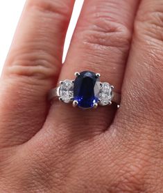 A platinum ring set with a 2.99ct sapphire and approximately 0.69ctw of G/VS diamonds. DESIGNER: None MATERIAL: Platinum GEMSTONES: Diamonds, Sapphire DIMENSIONS: Ring Size 6.5, Top is 9.3mm x 14mm MARKED/TESTED: Plat WEIGHT: 6.8 grams CONDITION: Previously Owned. Excellent Condition Estate Jewelry Earrings, Diamond Platinum Ring, Platinum Diamond Rings, Vs Diamond, Platinum Ring, Sapphire Diamond, Selling Jewelry, Ring Bracelet, Estate Jewelry