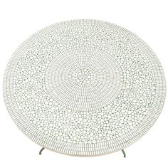 a white table with an intricate design on it