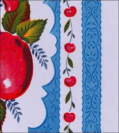 an apple and leaves design on a white background with blue trim around the edges, along with red cherries