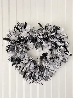 a black and white wreath hanging on the wall