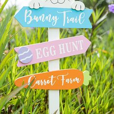 a wooden sign that says bunny trail, egg hunt, carrot farm and bunnies on it