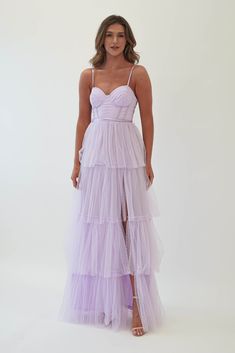 Highlights Gorgeous tulle maxi dress Left leg slit Padded cups Cute ribbon belt included. Sizing The model is 5'10 and wears UK size 8 / S / US size 4 Fit & Fabric Made from 100% Polyester Rear zip Adjustable straps Double lined True to size Length from top of bust to hem: 140cm Stretch: 6/10 Perfect for Wedding Guest Formal Events Pastel Purple Bridesmaid Dresses, Lavender Tulle Dress, Lilac Prom Dress, Black Tie Bridesmaids, Oh Hello Clothing, Lavender Bridesmaid Dresses, Lilac Bridesmaid Dresses, White Bridal Dresses, Cute Ribbon