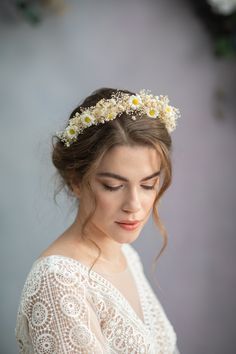 a woman wearing a flower crown in her hair