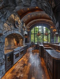 a large kitchen with an arched ceiling and wood flooring is pictured in this image