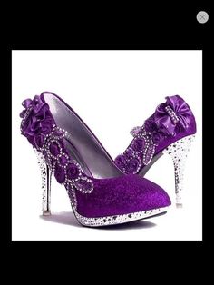 a pair of purple high heels with flowers on them