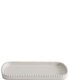 a white rectangular dish with beading on the edge and bottom, against a white background