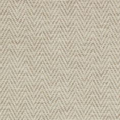 an upholstered beige and white fabric textured with rows of small, overlapping squares