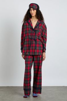 Our Antonella pyjama set in red tartan is comfortingly classic, with a contemporary twist in the bow details. • Top and bottoms • Matching storage bag included • Matching eye mask available • Button-down front • Chest pocket • Elasticated waist with functional tie • 100% organic cotton • Designed in London MODEL INFO: Model 1 is 5'10 and is wearing a UK 8. Fancy Pajamas, Damson Madder, Cosy Vibes, 2024 Wishlist, London Models, Pajamas Christmas, Cute Pajama, Christmas Pj, Gift Me