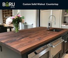 a kitchen island with a sink and dishwasher