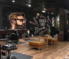 a barber shop with chairs, stools and pictures on the wall