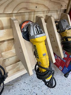 a yellow and silver fire hydrant sitting on top of a wooden bench next to power tools