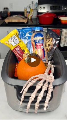 a basket filled with halloween treats on top of a counter