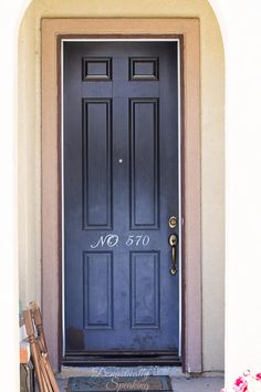 a blue front door with the number 70 on it